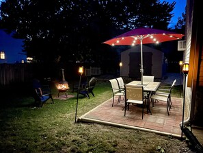Beautiful backyard patio and fire pit to gather around