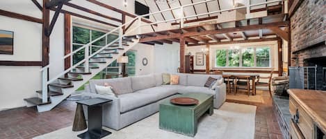 Hang out with the family in this cathedral-ceilinged living room and loft