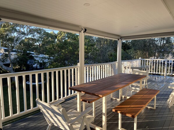 Alfresco dining area which can become fully enclosed with the roller blinds. 