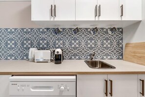 Tiled Galley Kitchen w dishwasher and microwave