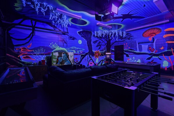 NEVER SEEN BEFORE in the entire NC market! Prepare to be transported to a realm of wonder & awe in this mystically enchanting glow jungle themed GameRoom! Scroll through the album for more...