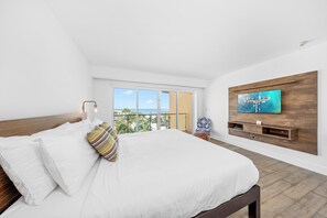 Retreat to luxury in our main bedroom featuring a TV and attached bathroom. Enjoy ultimate comfort and convenience in your private sanctuary.