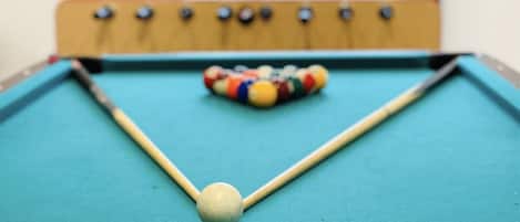 Come play pool with us and many other games throughout your stay!