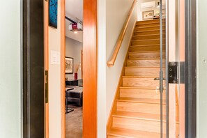 Stairs at entry lead to second floor kitchen, bath and sleeping area. 