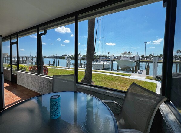 Wrap around, screened in porch surrounding this waterfront unit. - Wrap around, screened in porch surrounding this waterfront unit. Watch the boats go by plus dolphins and other wildlife play!