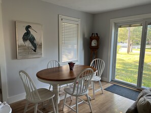 Dinning area that seats 4 people in the open concept to the living room.