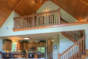 Open floor plan with vaulted ceiling