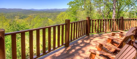 Huge deck with plenty of Adirondack chairs