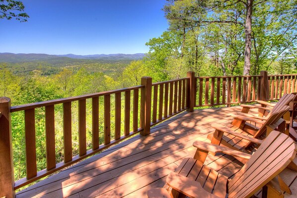 Huge deck with plenty of Adirondack chairs