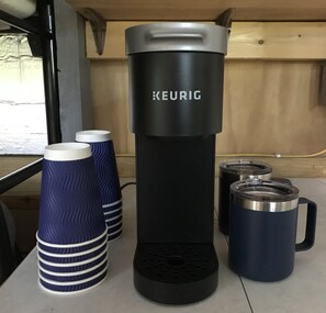 Keurig coffee maker. Ass’t pods provided but bring your own if have a favorite. 