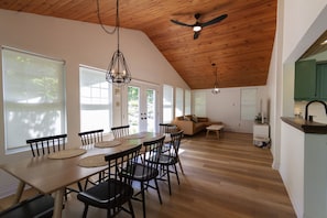 The eight seat dining table & TV room. 