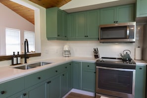 Newly renovated kitchen, with all appliances, cookware & tableware. 