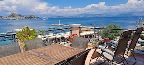 LARGE VERANDA WITH A VIEW OF THE OLD FORTRESS OF CORFU