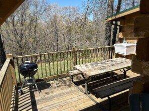 Out door sink with charcoal grill.