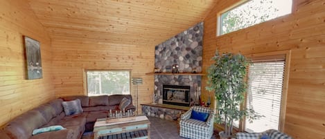 Enjoy the sights and smells of the wood fireplace in the living room. 