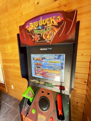 Challenge a partner to a game of Big Buck Hunter!