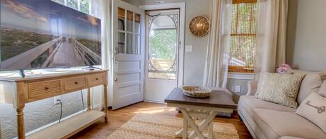 Main entrance into the guest apartment via outdoor stairs leading to living area