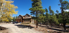 Main house and 1/2 circle drive entrance. Please note uneven and rocky terrain.