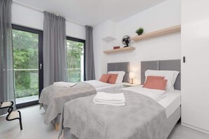 Two comfortable single beds in the bedroom. 