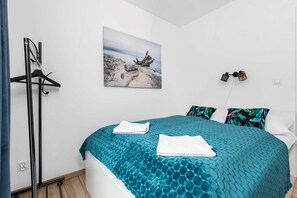 The cosy bedroom features a luxurious double bed.