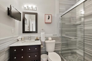 Full size bathroom with shower, tub and vanity.  Jetted Tub, ceramic walls and a nice clean comfortable vibe. 