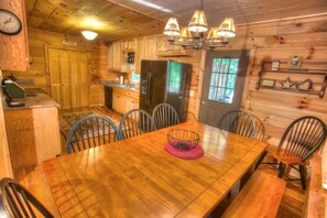 View of kitchen from dining table seats 8-10