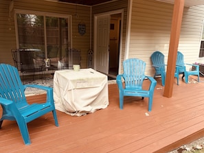 Covered deck with chairs and fire pit