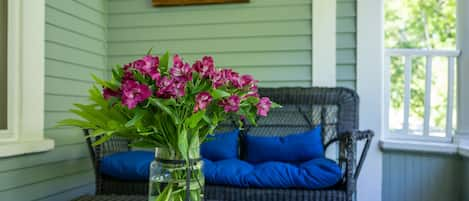 A beautiful porch welcomes you home. Enjoy your coffee, breakfast or a cocktail!