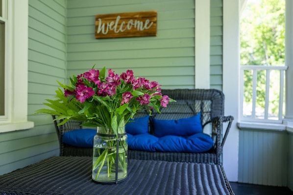 A beautiful porch welcomes you home. Enjoy your coffee, breakfast or a cocktail!