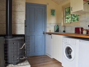 Wood burner | The Shepherd’s Hut at Calvesfield Shaw - Chilsham Farm Nurseries, Herstmonceux, near Hailsham