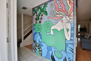 Entry way art - Mural through front door, giving the house it's name: Crazy Mermaid!