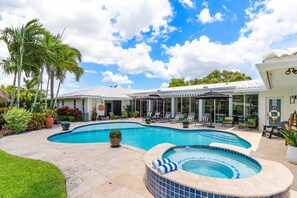 Gorgeous built in spa with waterfall feature into the pool.