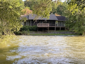 View of the cottage from across the river