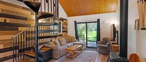 Living room with fireplace and custom wood backdrop