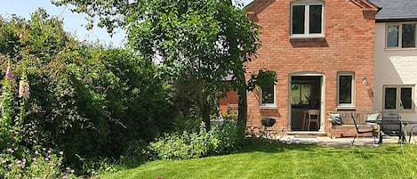 The patio and garden at the back of the house.