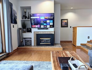 Cozy fireplace and Roku TV with lots of streaming apps included.