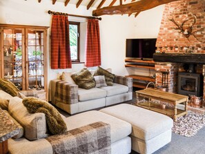 We never want to leave the cook on their own in the kitchen. Everybody can mckane with the cooking and sit, relax and watch TV at the same time | Lodge Farm Barn, South Walsham