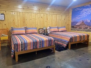 queen size beds in the Seek and Snore Cabin at The Lazy Buffalo, Cache OK