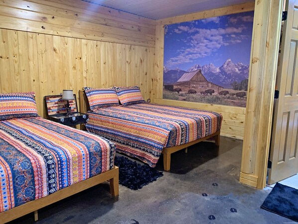 comfy queen sized beds in the Seek and Snore Cabin at The Lazy Buffalo, Cache OK