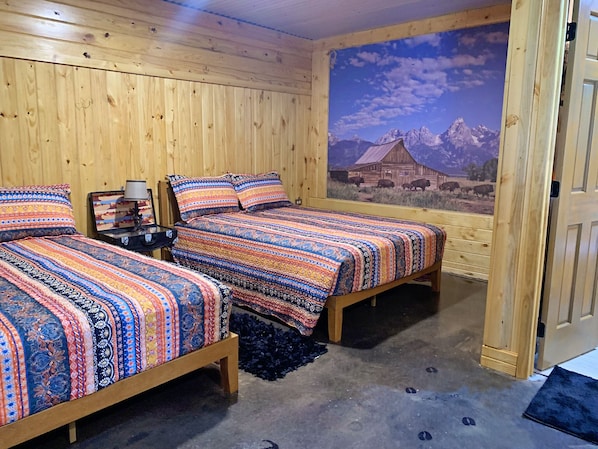 comfy queen sized beds in the Seek and Snore Cabin at The Lazy Buffalo, Cache OK