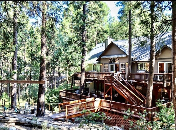Enchanted wooded enclosed backyard - perfect for families. 15,000 Sq Ft lot.