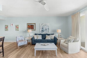 Living Area with Private Balcony Access, Ocean Views, Flat Screen TV and Sleeper Sofa