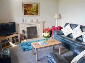 Cosy living room with open fire | Croft Cottage, Gairloch, Wester Ross