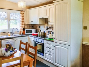 Kitchen area | Old Smithy BungalowsRobins Nest Bungalow, Welcombe, near Hartland