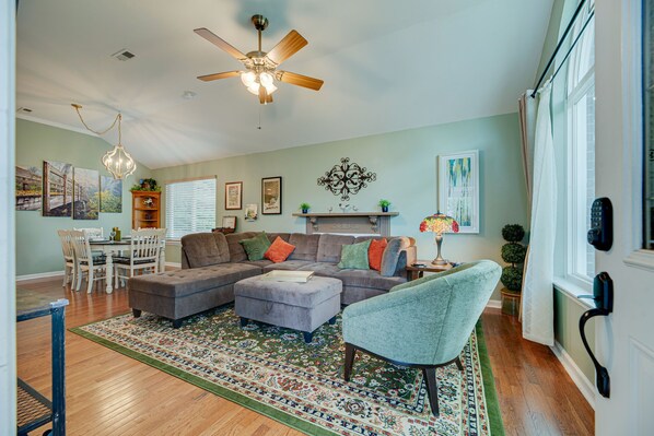 Welcome to a warm & comforting front great room with living & dining areas