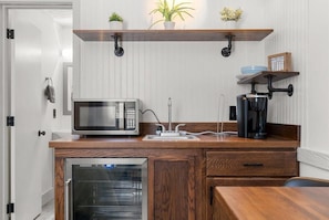 Our kitchenette features a microwave, keurig, and mini fridge.