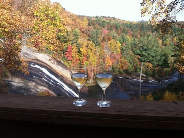 Enjoy a glass of wine together on the relaxing front waterfall porch 