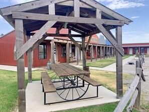 gather around the picnic table for lunch while staying at The Lazy Buffalo