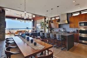 Oceanfront Entertaining & Dining- designer Kitchen w/ stainless Wolf Appliances.