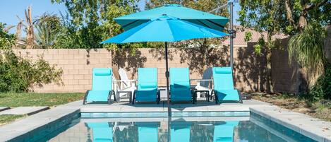 Loungers and outdoor space by the pool side with cold drinks